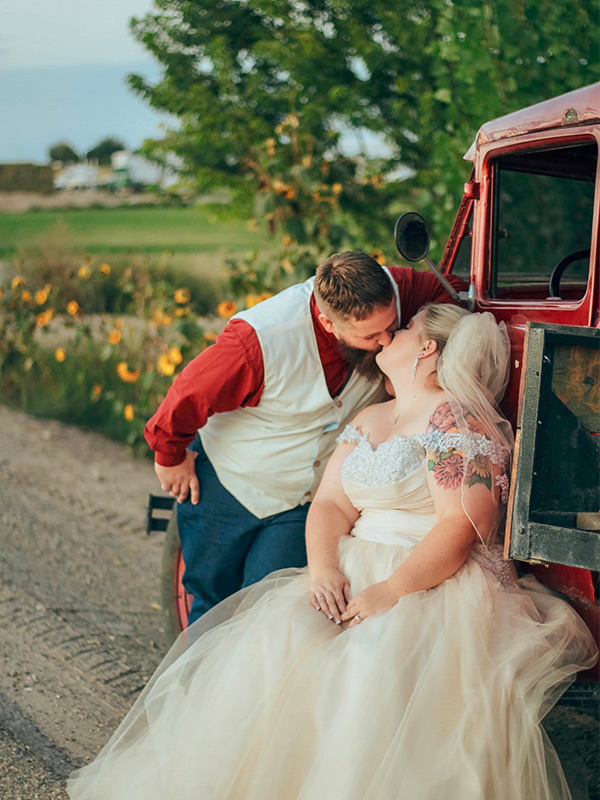 Bride & Groom next to classic red truck