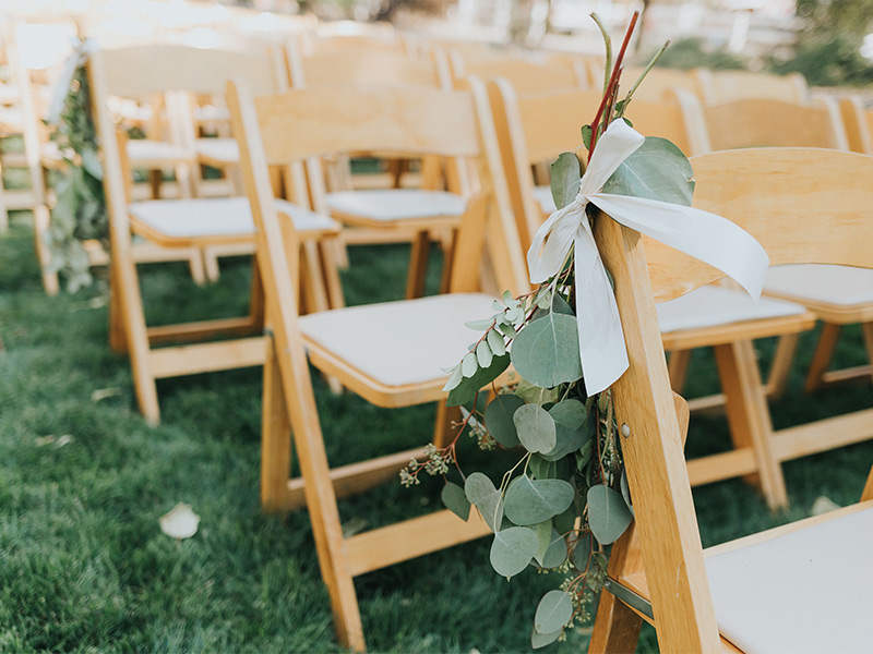 Outdoor chairs set up for wedding day